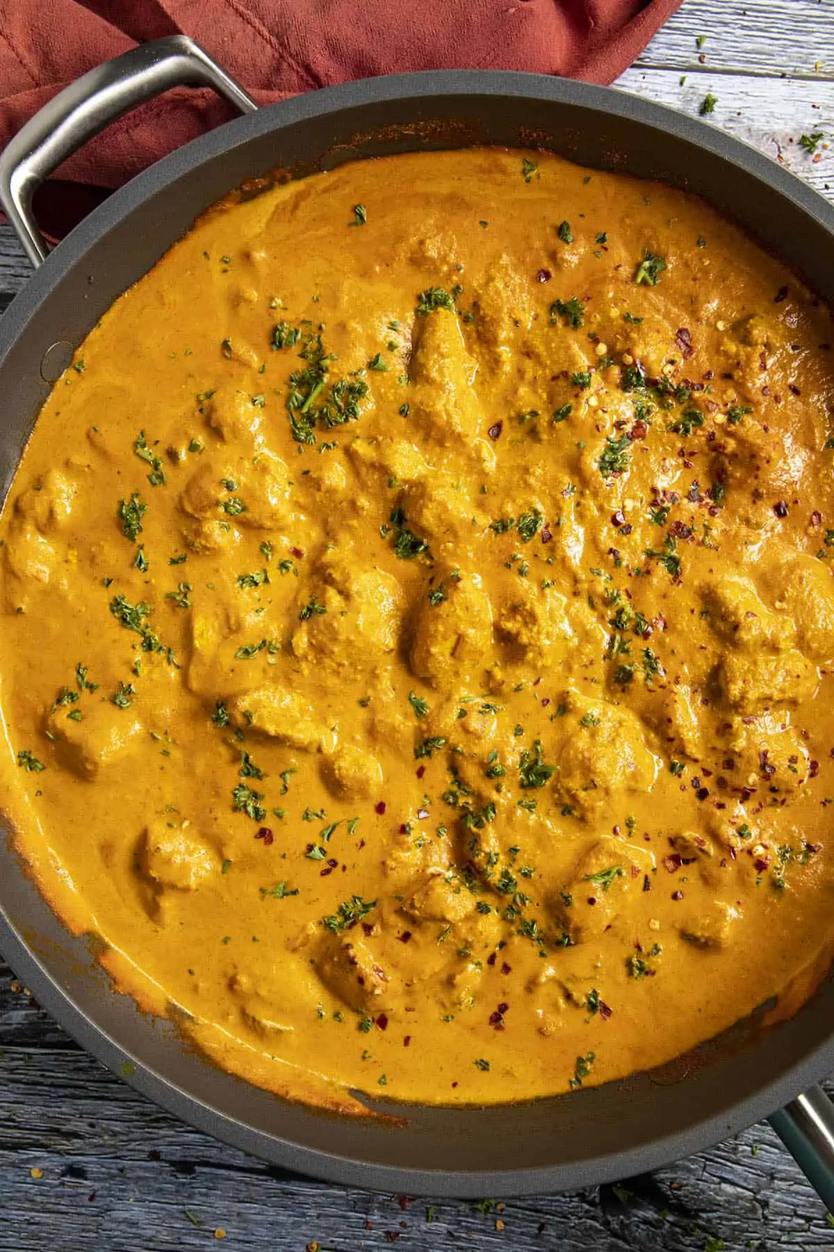 Chicken Tikka Masala in a pan with garnish