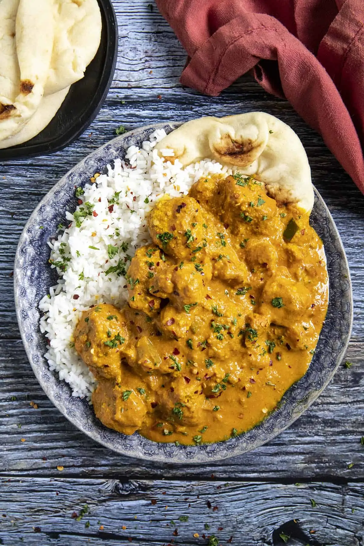 Chicken Tikka Masala on a plate with pita bread