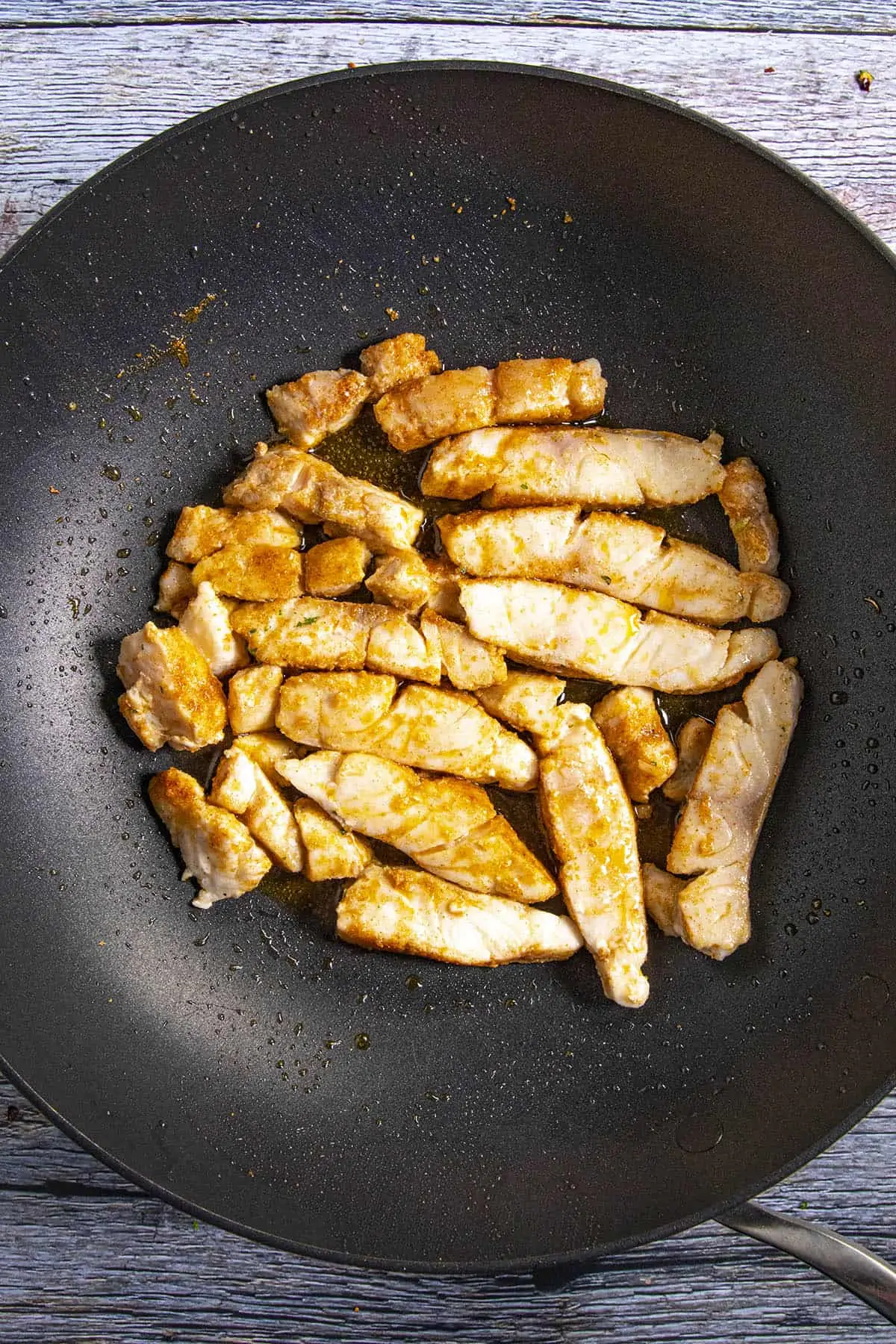 Cooking the fish in a pan to make fish tacos