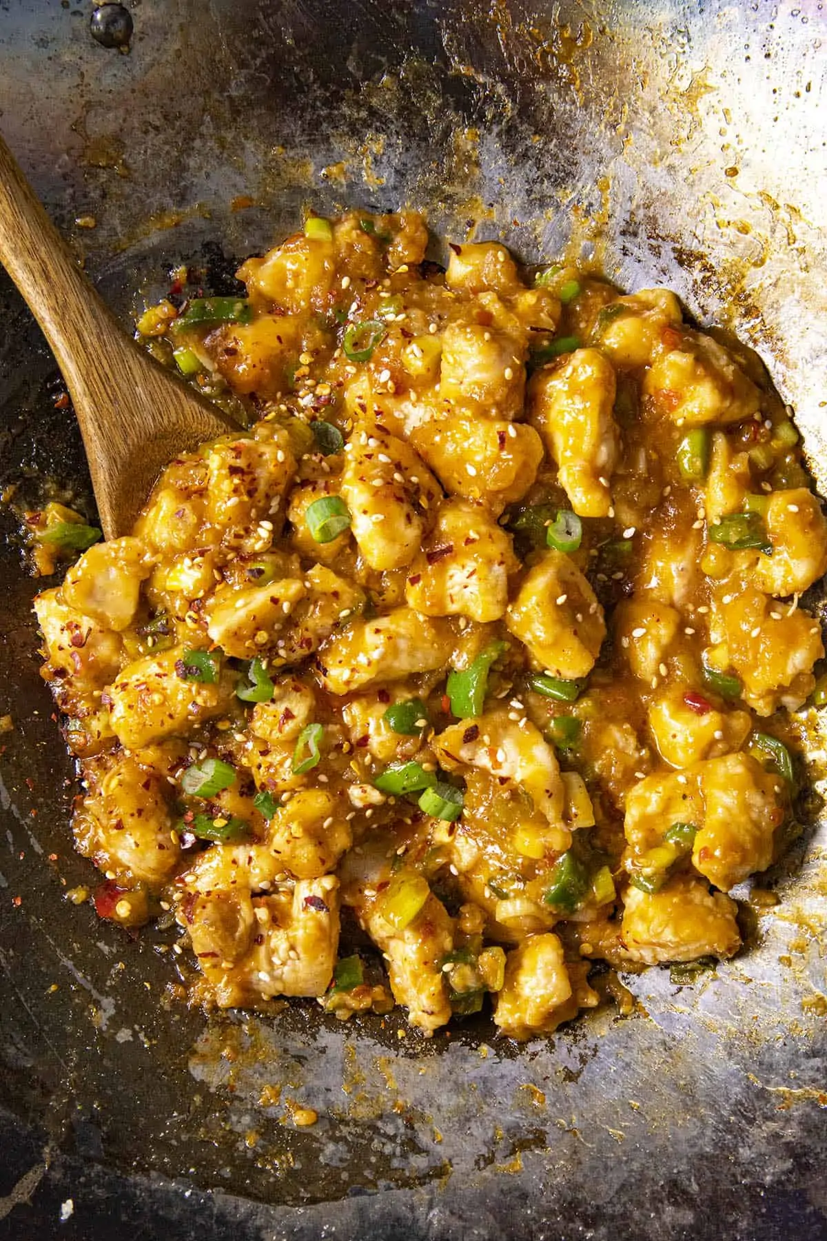 Serving General Tsos Chicken from the pan.