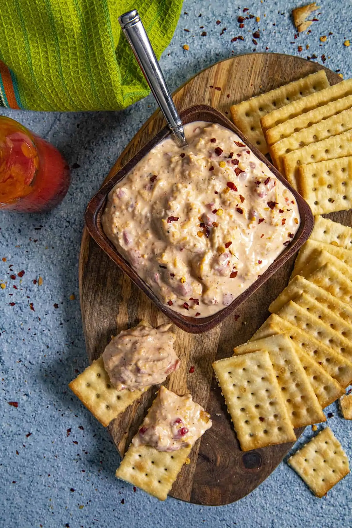 Serving Pimento Cheese on a serving board with extra crackers