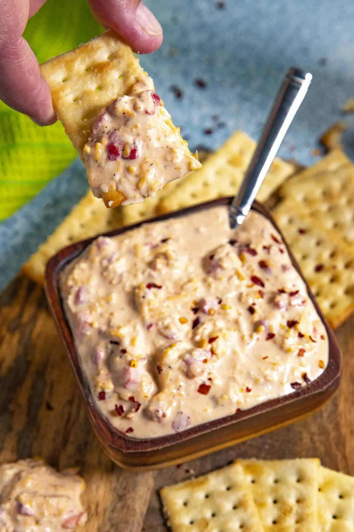 Mike scooping Creamy Pimento Cheese on a cracker