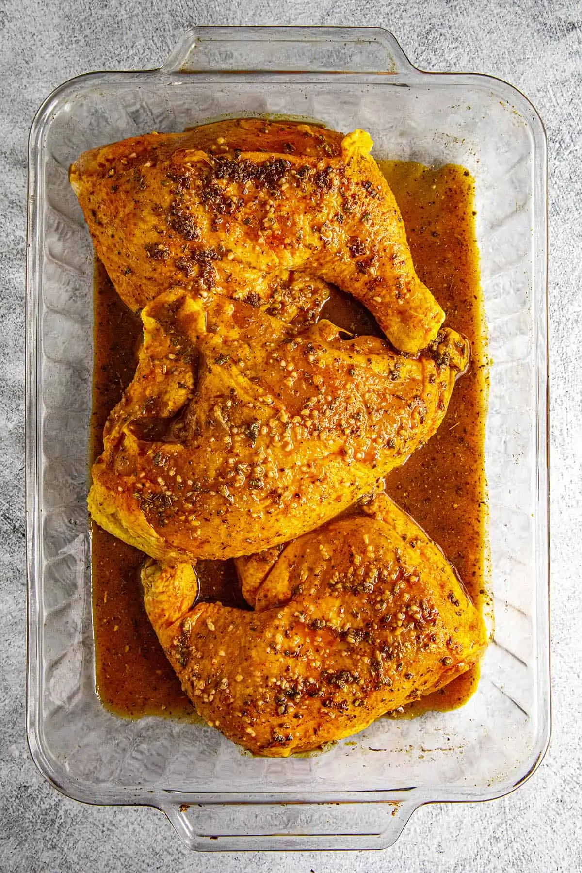 Pollo Asado (Mexican roast chicken) marinating in a dish