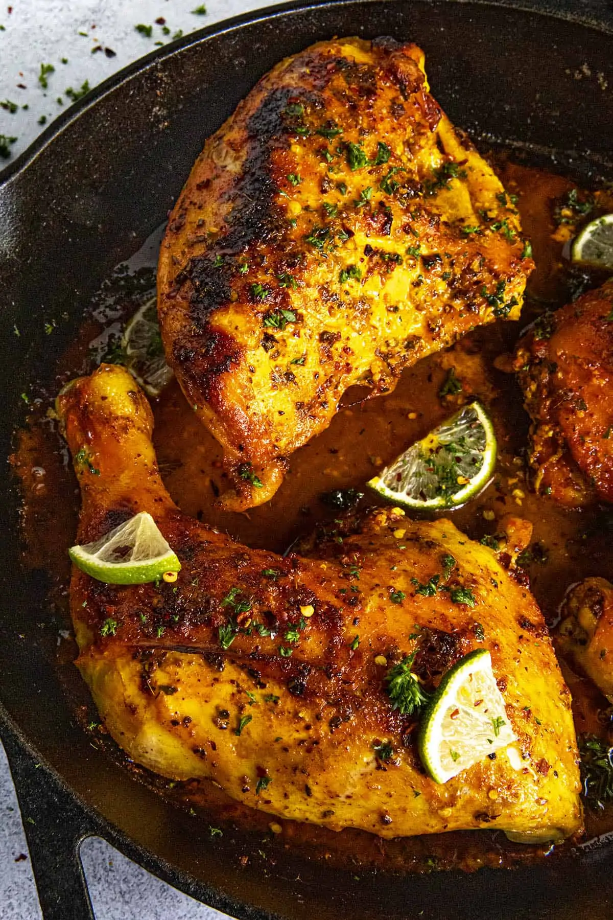 Pieces of Moist and juicy Pollo Asado (Mexican roast chicken) in a pan