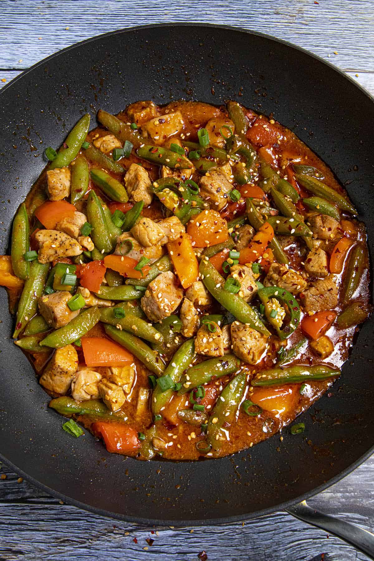 Spicy Pork Stir Fry in a pan with garnish.