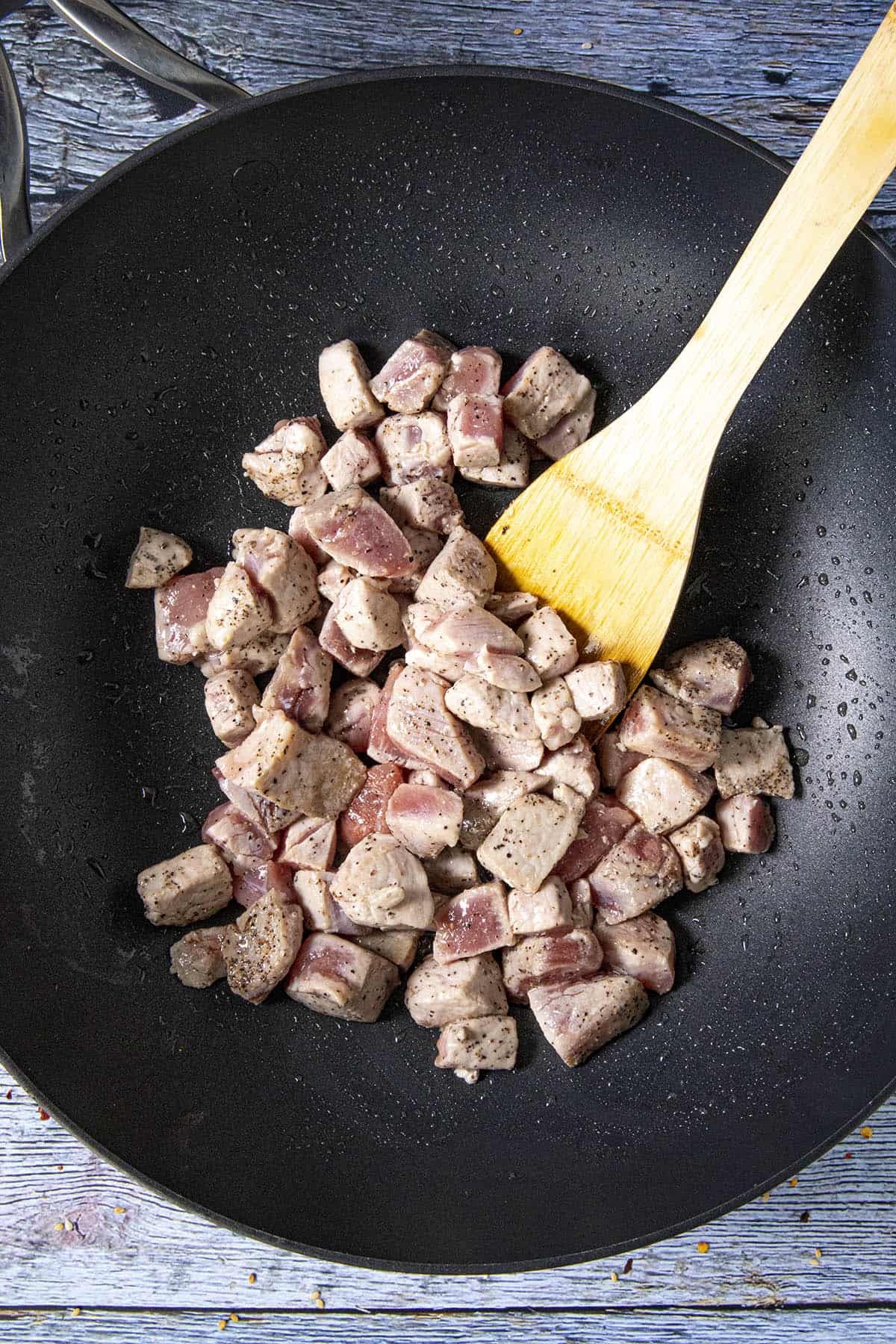 Cooking chunks of pork tenderloin in a pan to make Pork Stir Fry.