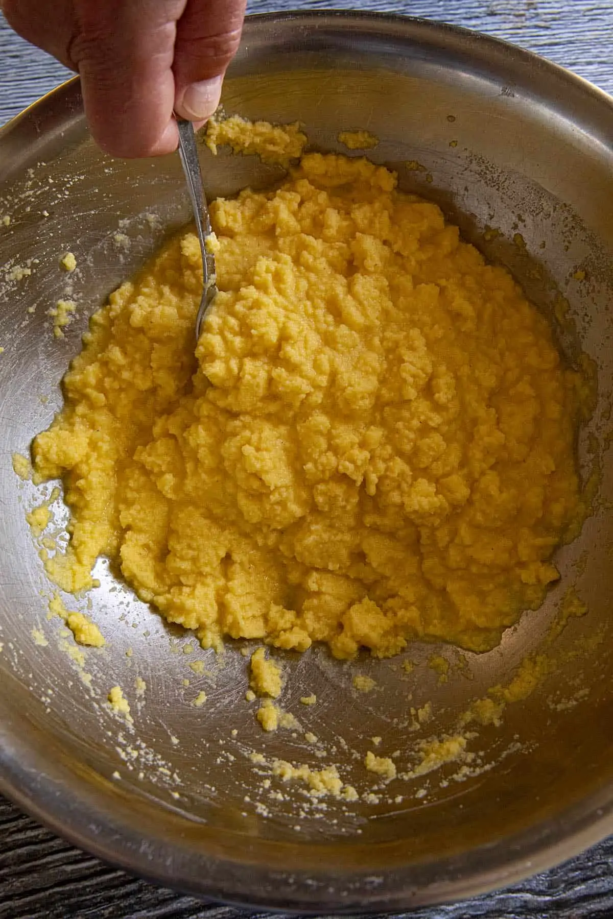 Mike mixing Arepas batter in a bowl
