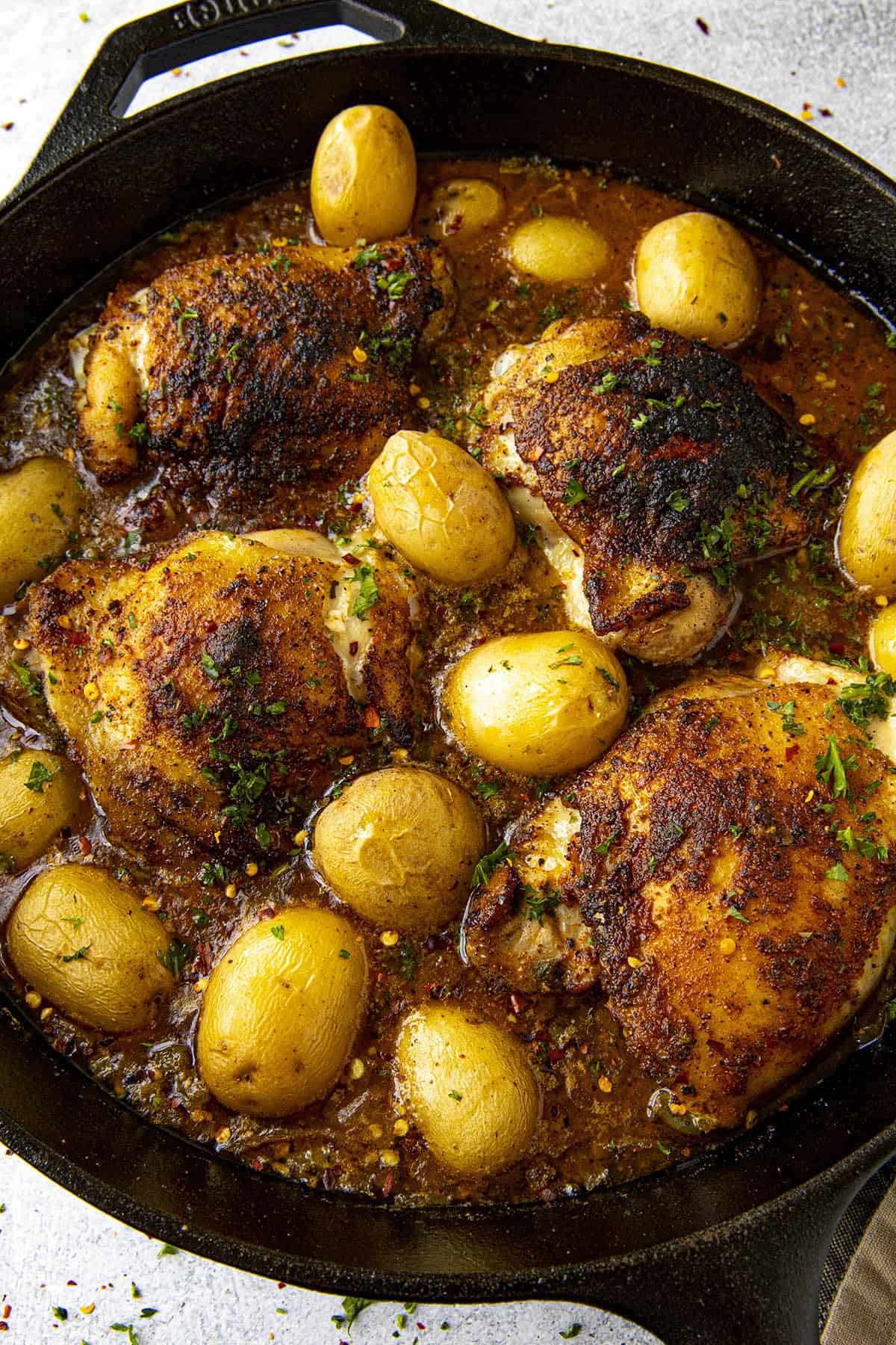 Cajun Baked Chicken Thighs in a hot pan.