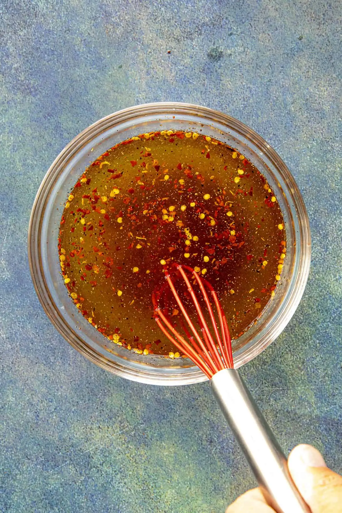 Whisking Carolina Vinegar BBQ Sauce Ingredients in a bowl.