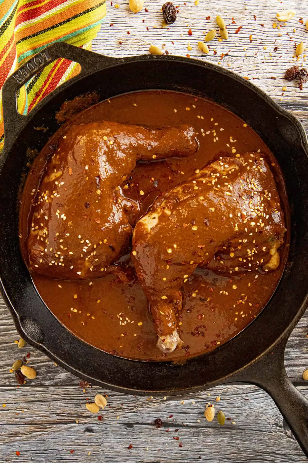 Chicken Mole in a pan with garnish