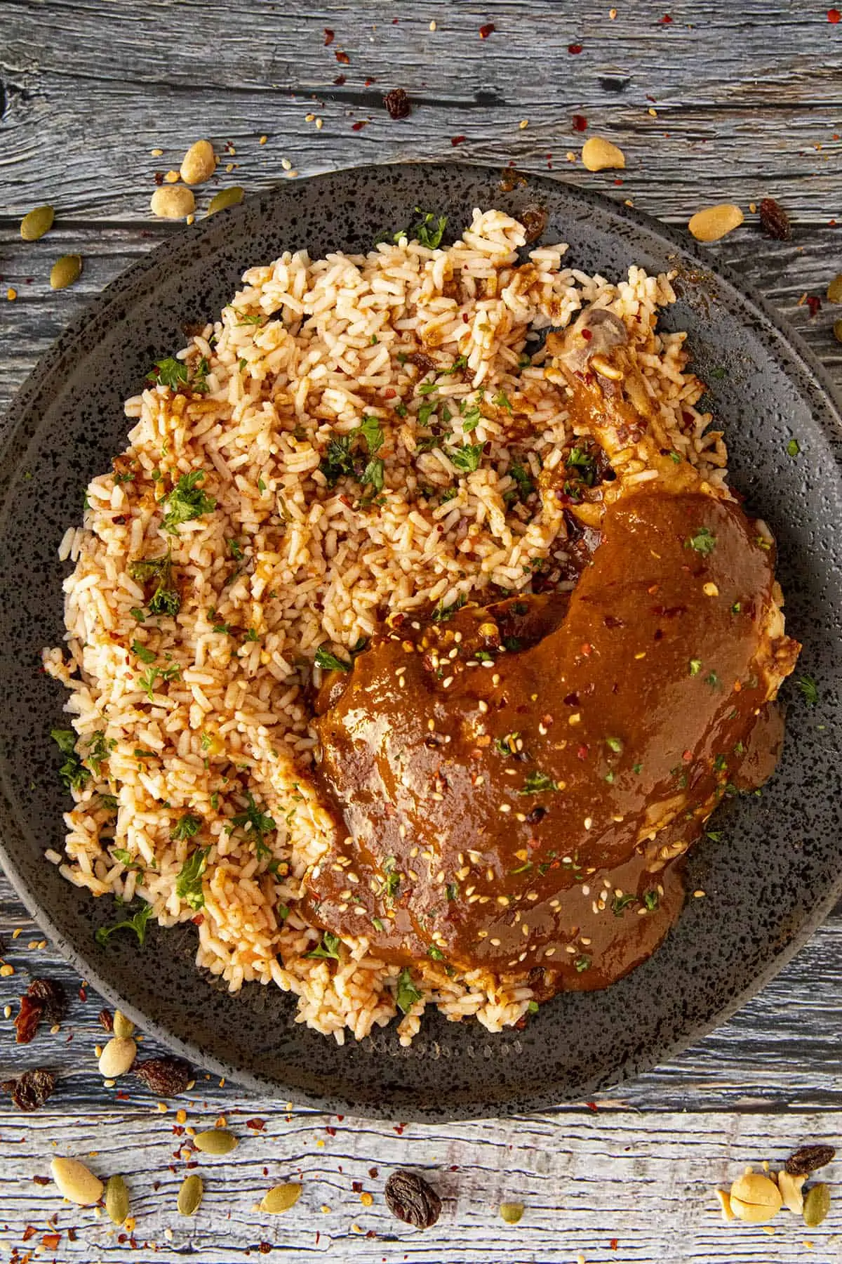 Chicken Mole on a plate with Mexican rice.