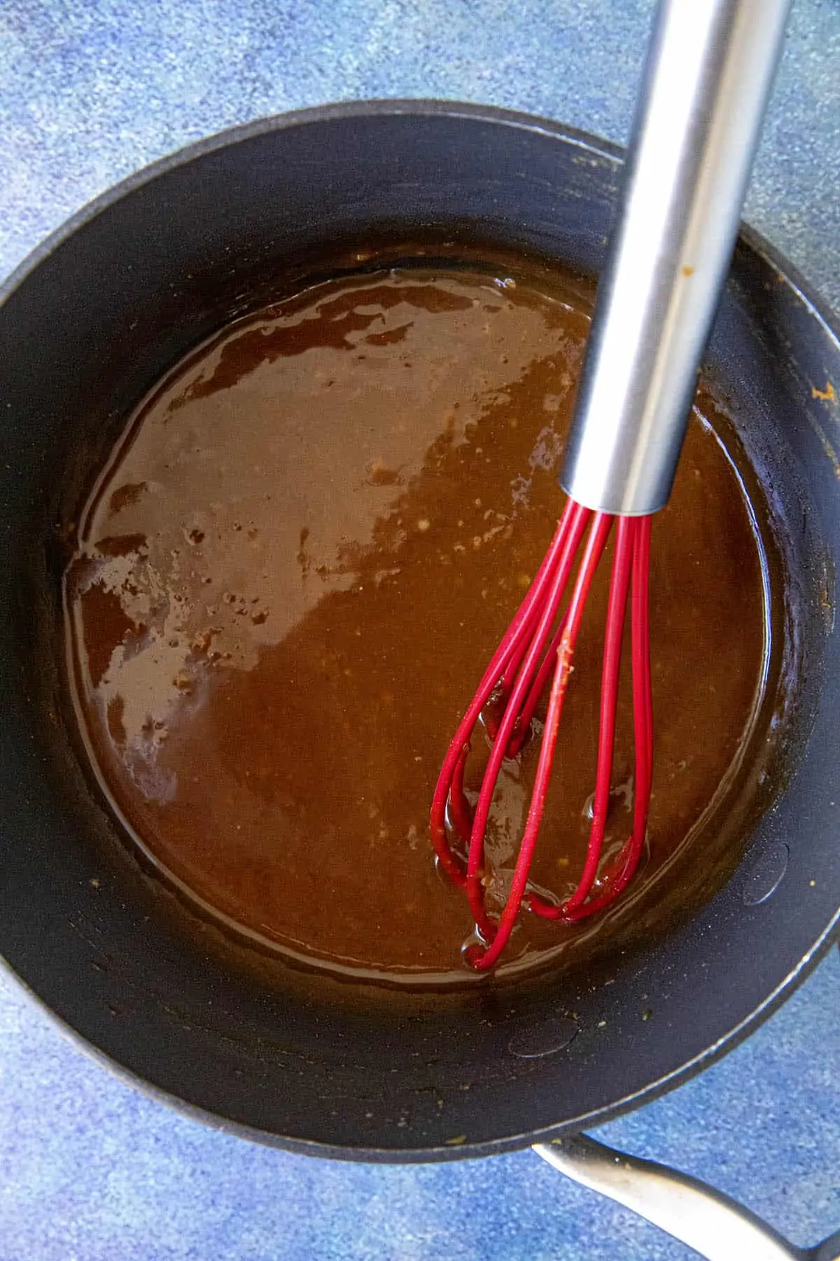 Whisking the sauce for making miso ramen