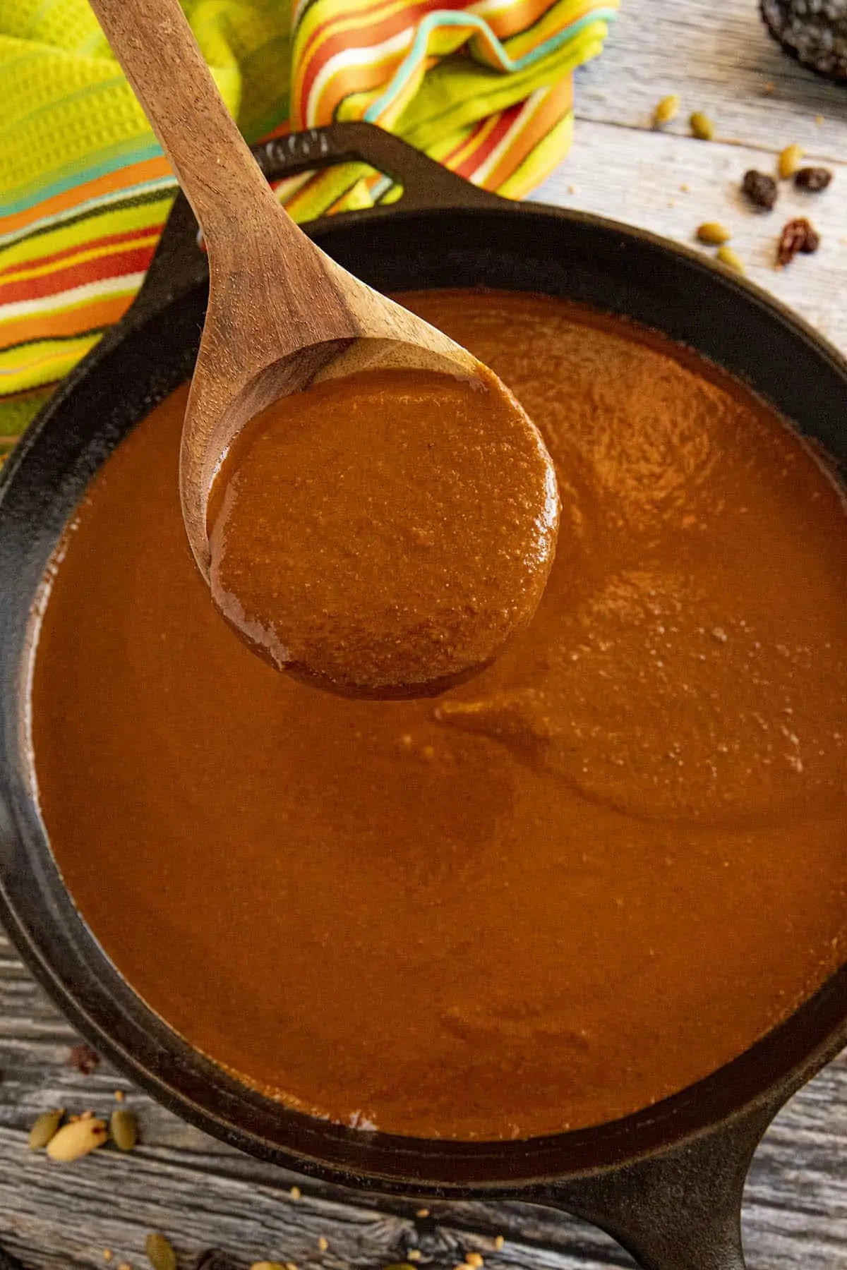 Mike scooping up some Mole Poblano sauce from the pan.