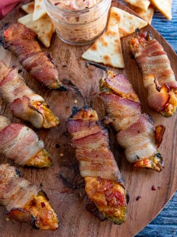 Pimento Cheese Jalapeno Poppers on a wooden board.