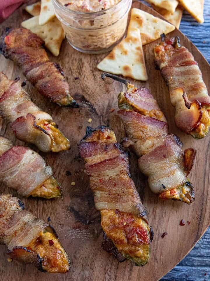 Pimento Cheese Jalapeno Poppers on a wooden board.