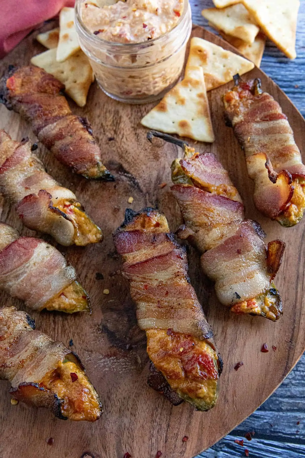 Pimento Cheese Jalapeno Poppers on a wooden board.