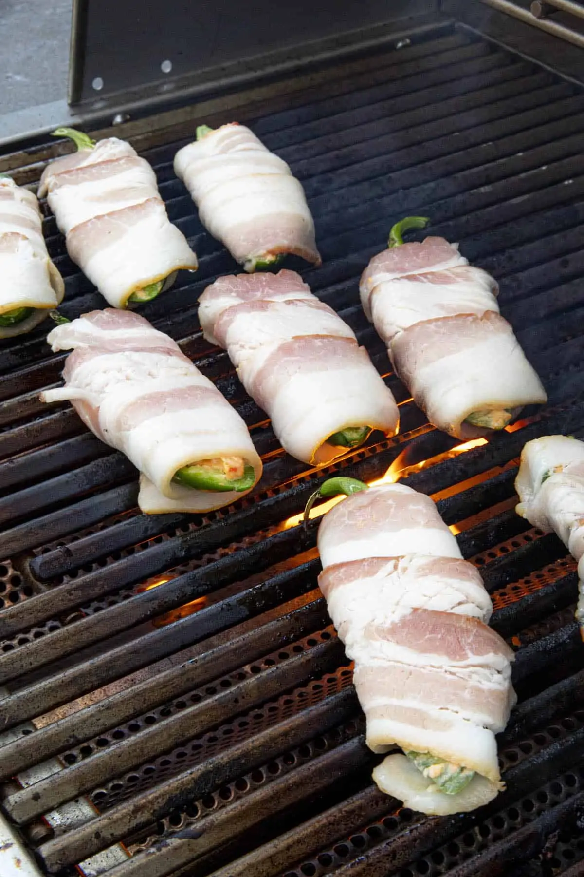 Pimento Cheese Jalapeno Poppers placed on the hot grill