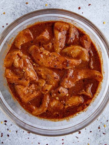 Fajita Marinade with chunks of chicken in a bowl