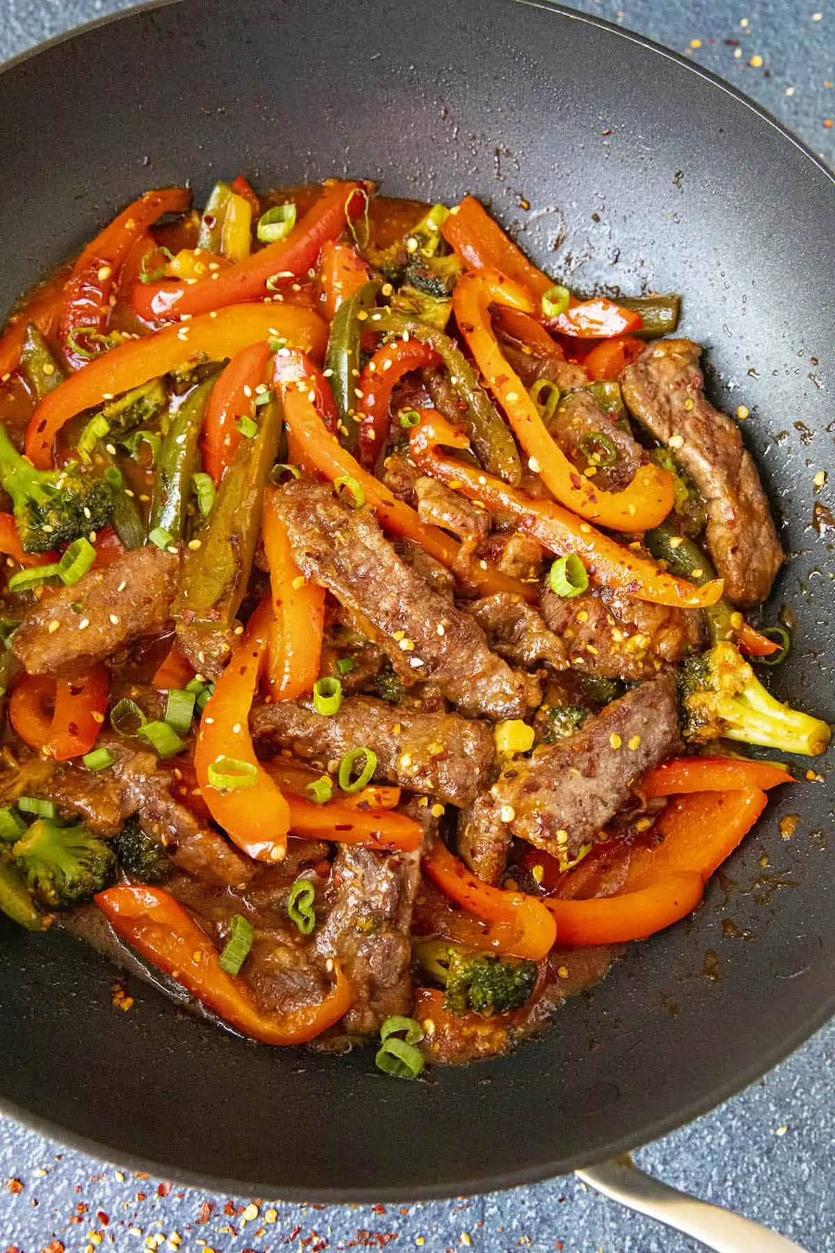 Spicy Beef Stir Fry in a pan with peppers and broccoli.