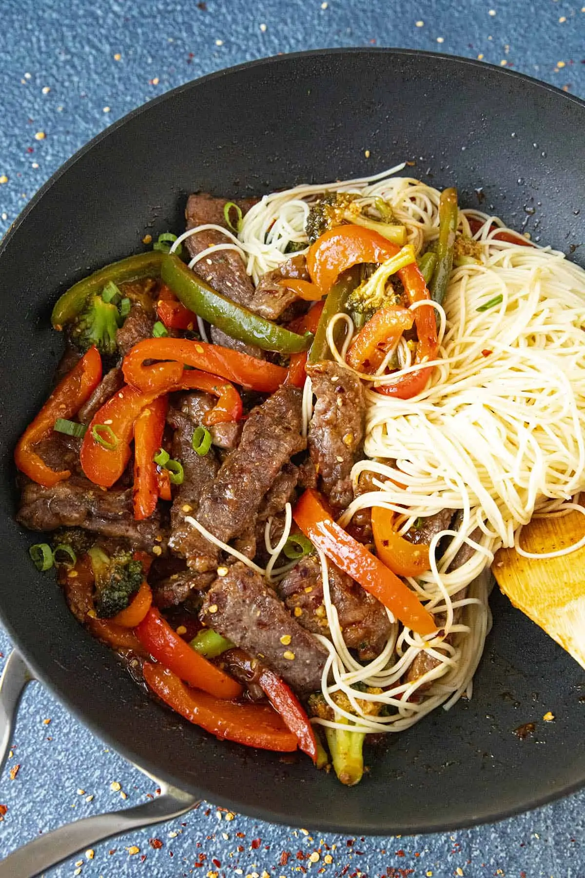 Stirring noodles into the Beef Stir Fry.