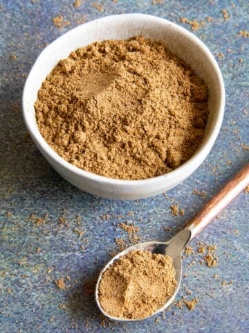 Chaat Masala Indian spice blend in a bowl and a spoon.