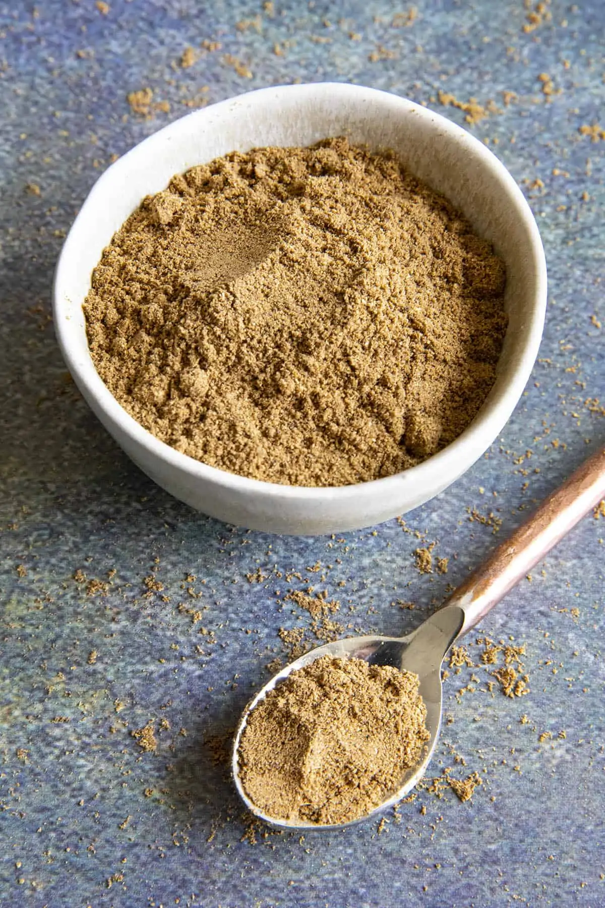 Chaat Masala Indian spice blend in a bowl and a spoon.