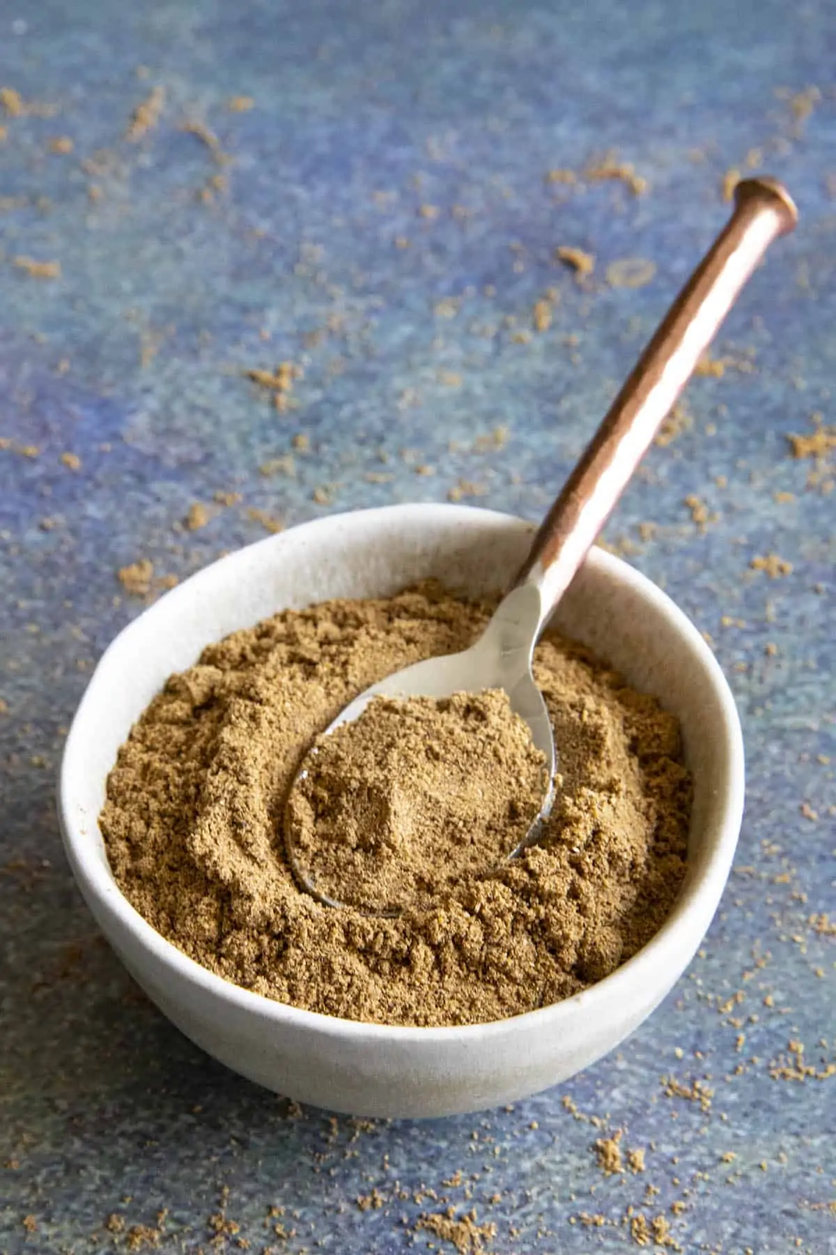 Chaat Masala in a bowl with a spoon.