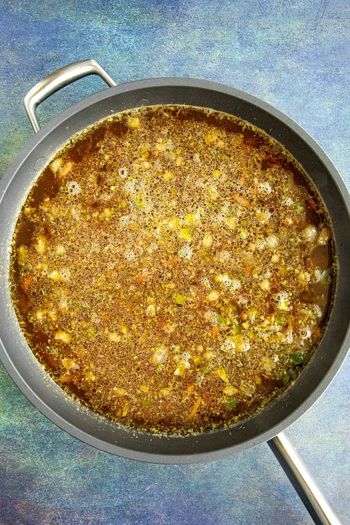 Simmering the charro beans in a pan