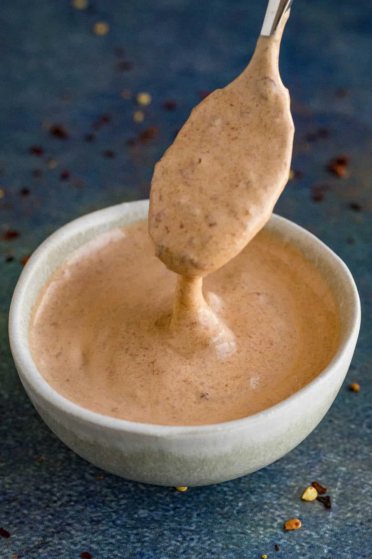 Creamy Chipotle Mayo dripping from a spoon.