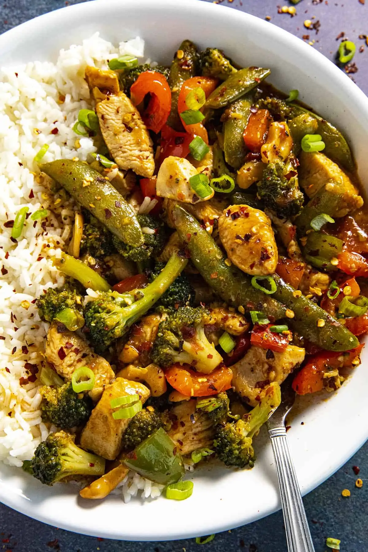 Chicken Stir Fry in a bowl with white rice, ready to serve
