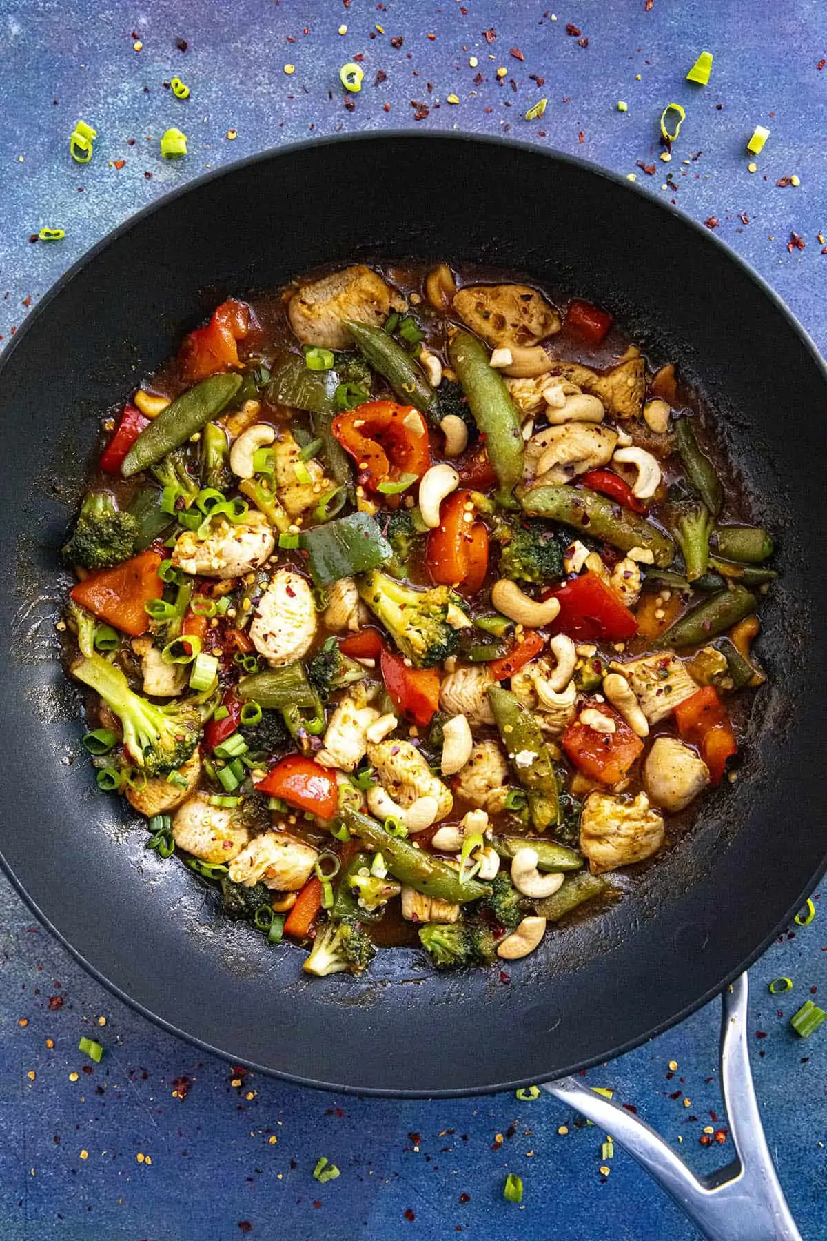 Garnished Chicken Stir Fry in a pan, ready to serve.