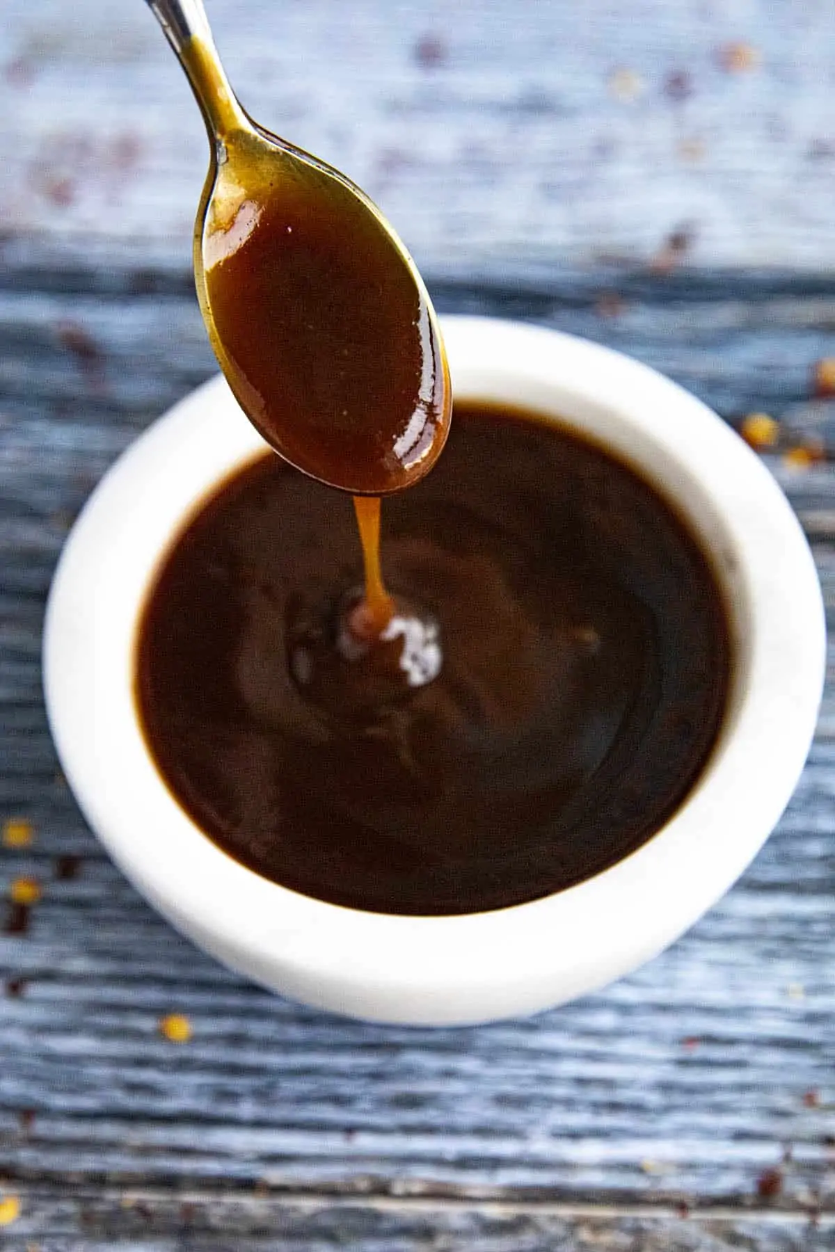 Easy Tonkatsu Sauce dripping from a spoon.