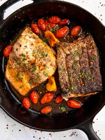 Jerk Salmon in a skillet.