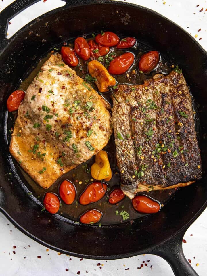 Jerk Salmon in a skillet.