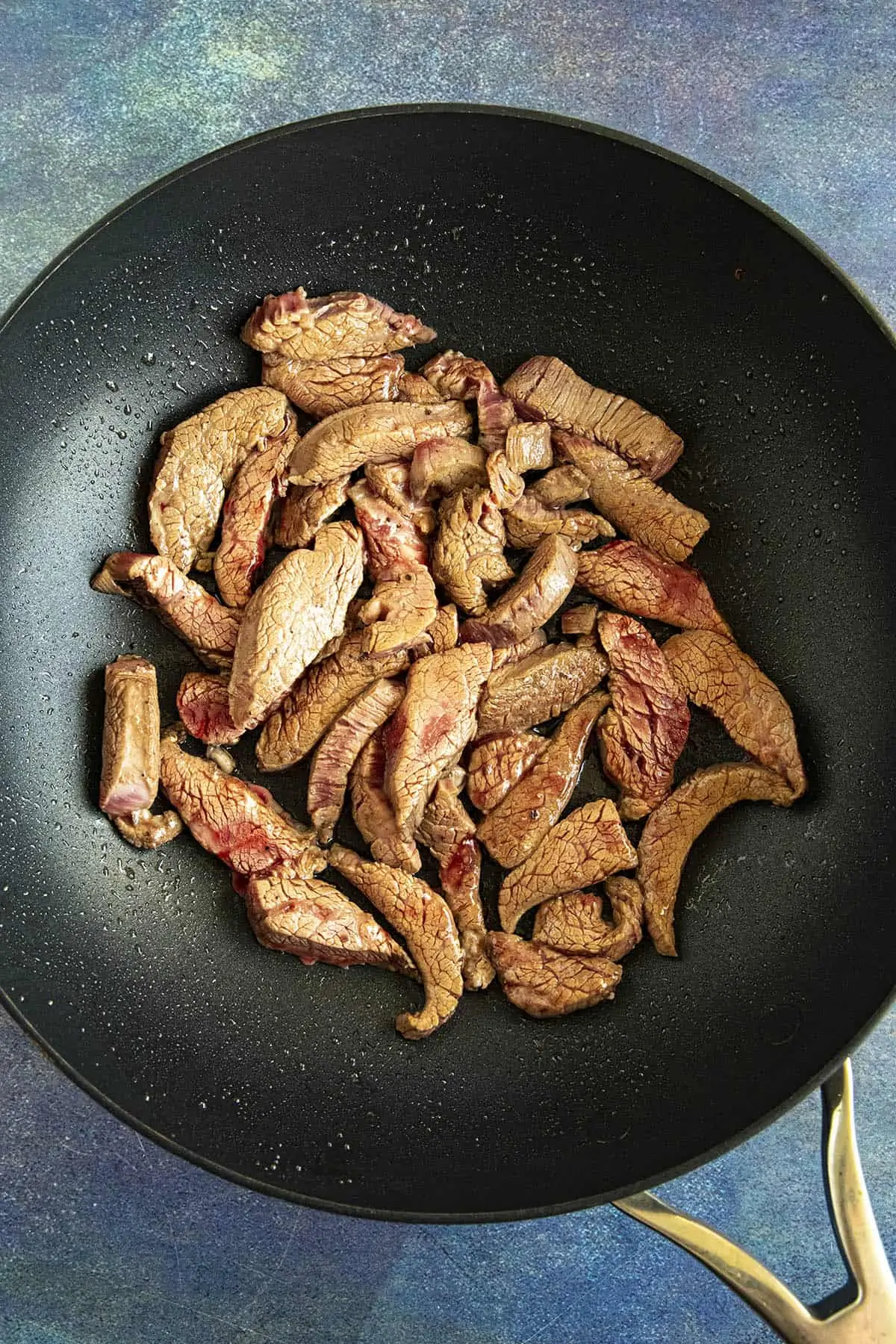 Cooking the beef in a hot pan