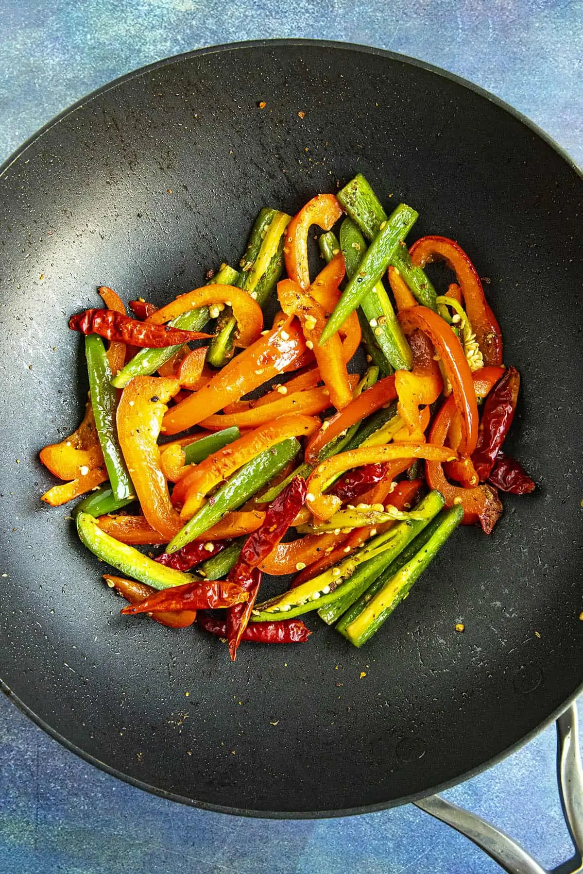 Cooking the peppers in a hot pan