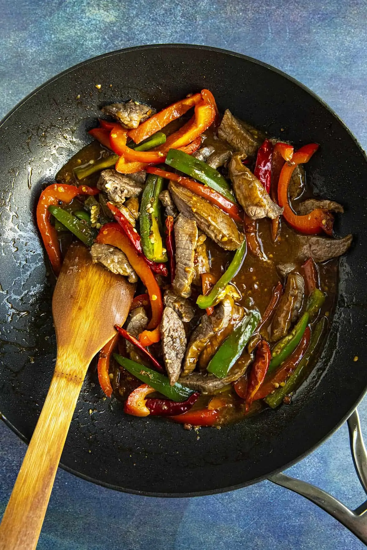 Stirring together the Szechuan Beef ingredients in a hot pan