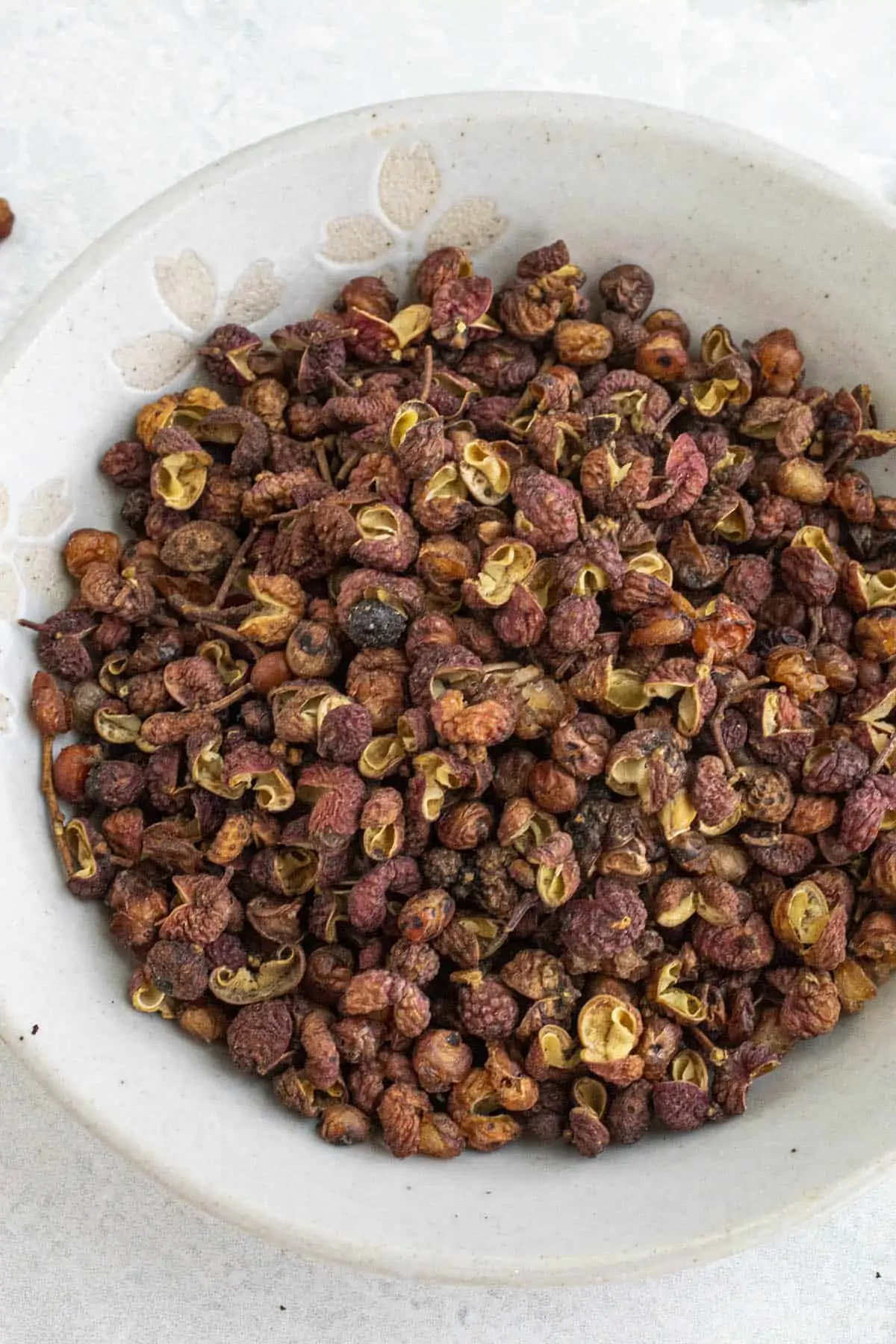 Sichuan peppercorns in a bowl.