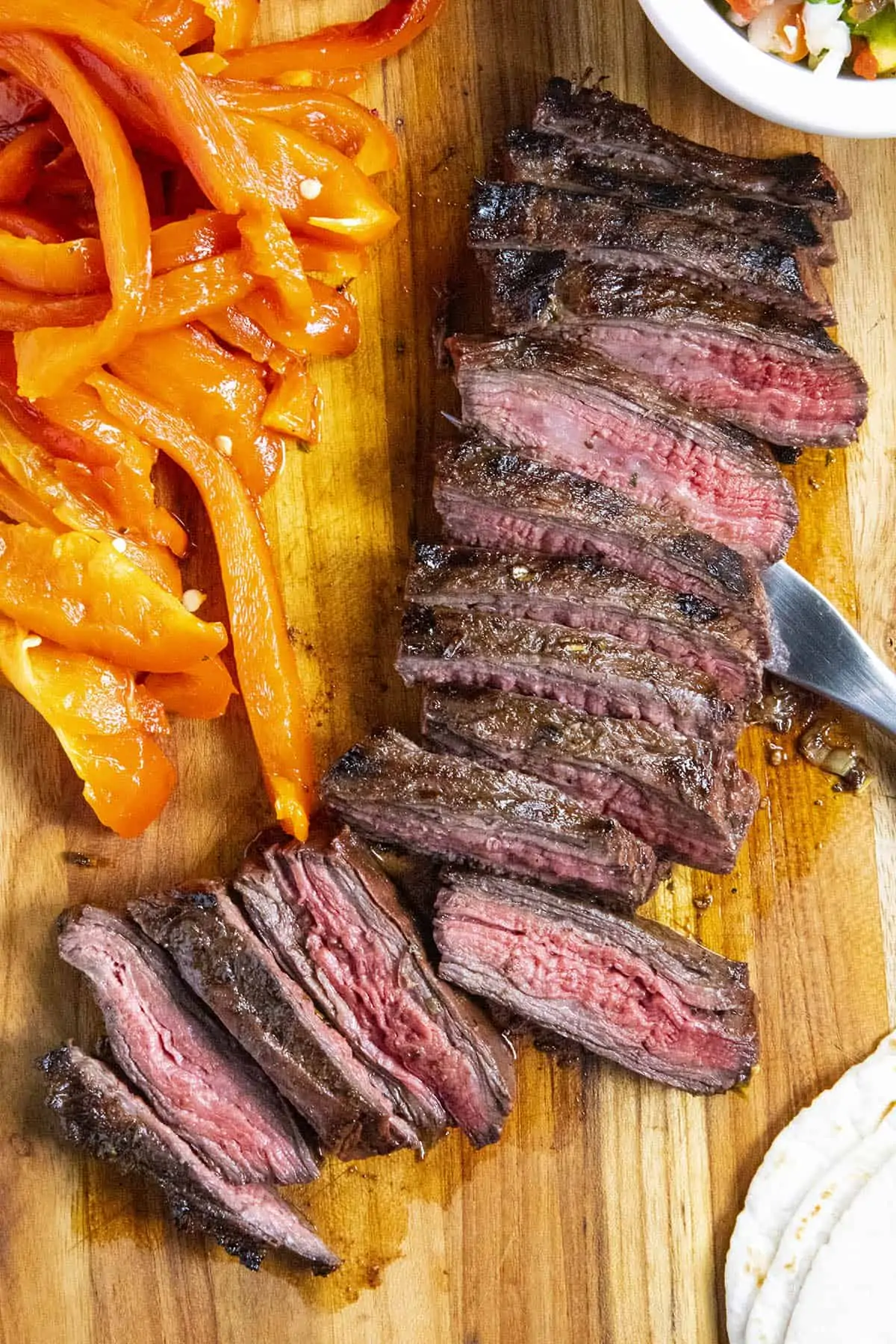 Tacos al Carbon on a cutting board, ready to serve.