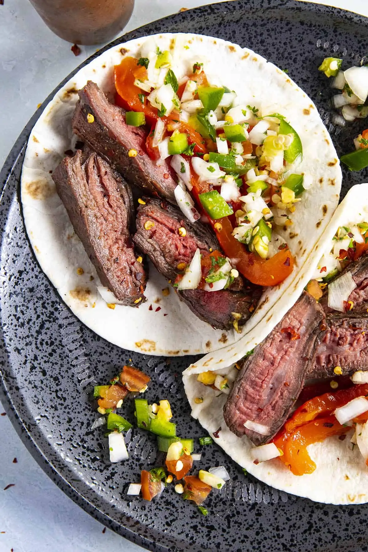 Steak tacos on a plate, aka tacos al carbon.