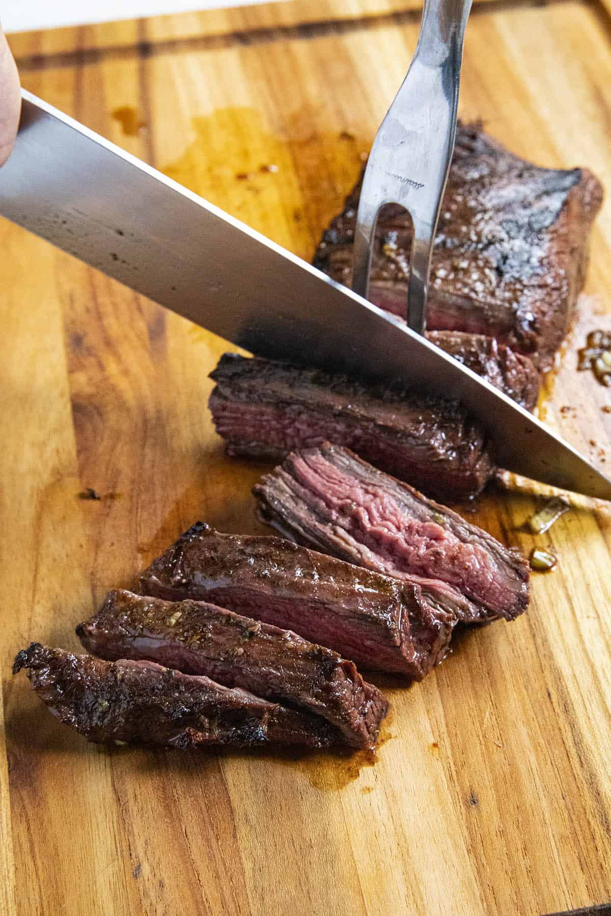 Slicing flank steak for grilled steak tacos.