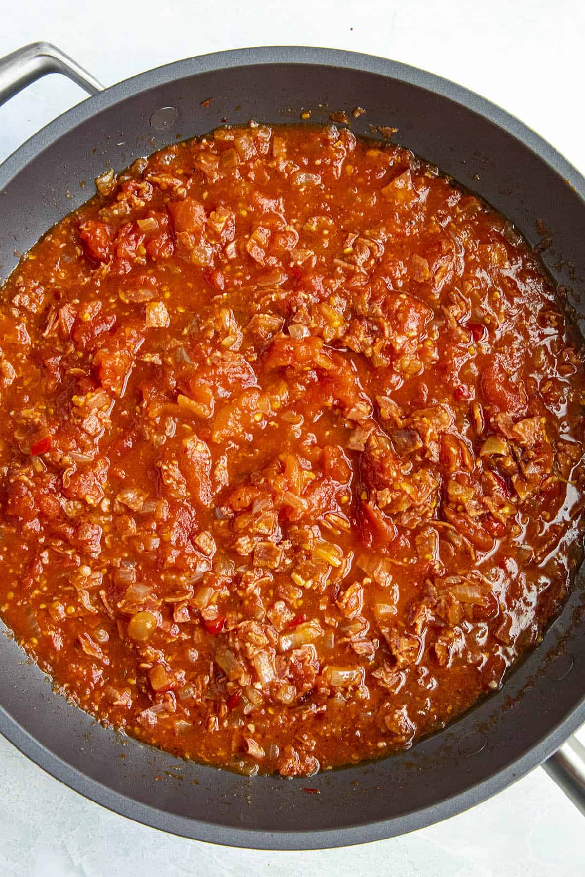 Simmering Amatriciana sauce in a pan