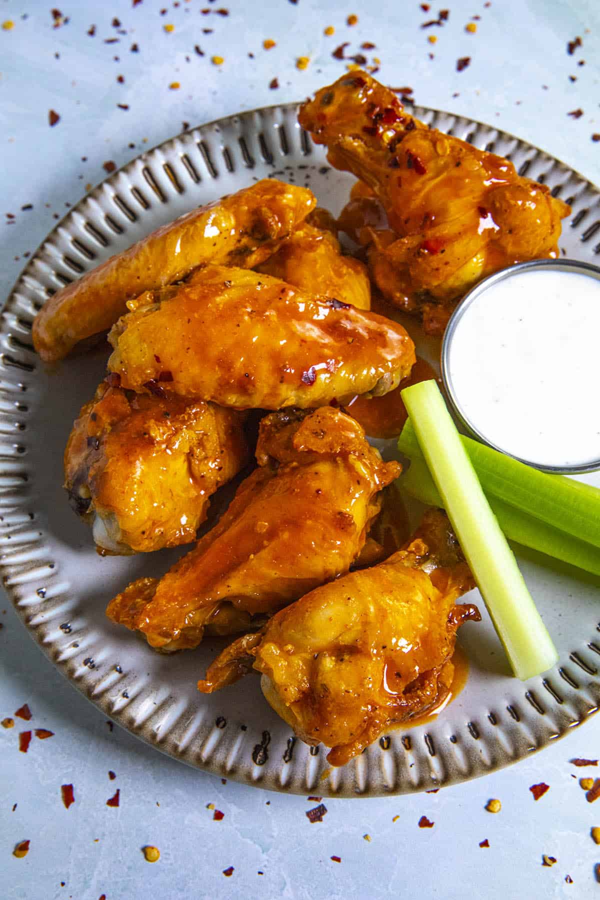 Saucy Buffalo Wings on a plate, ready to serve