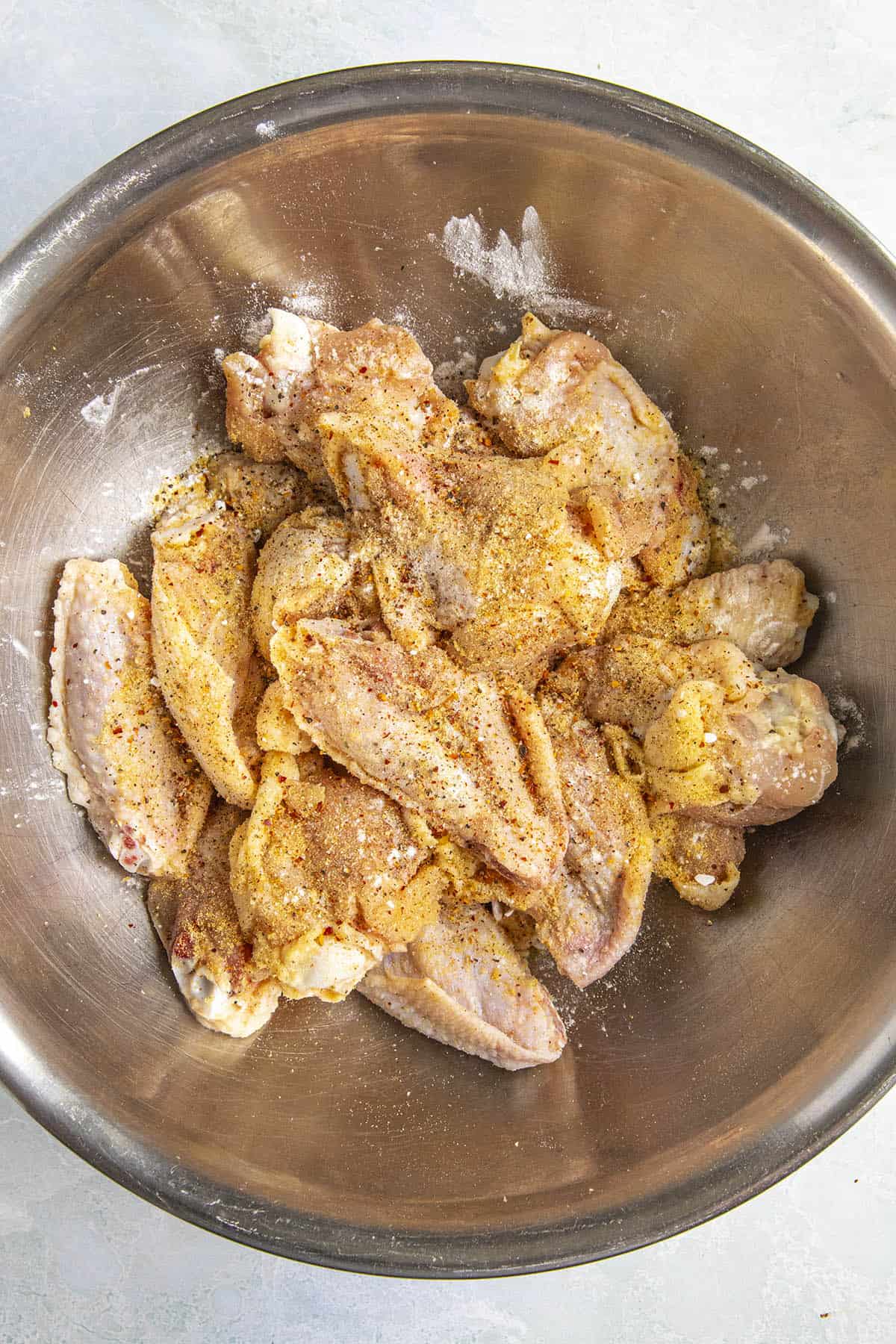 Seasoning the chicken wings