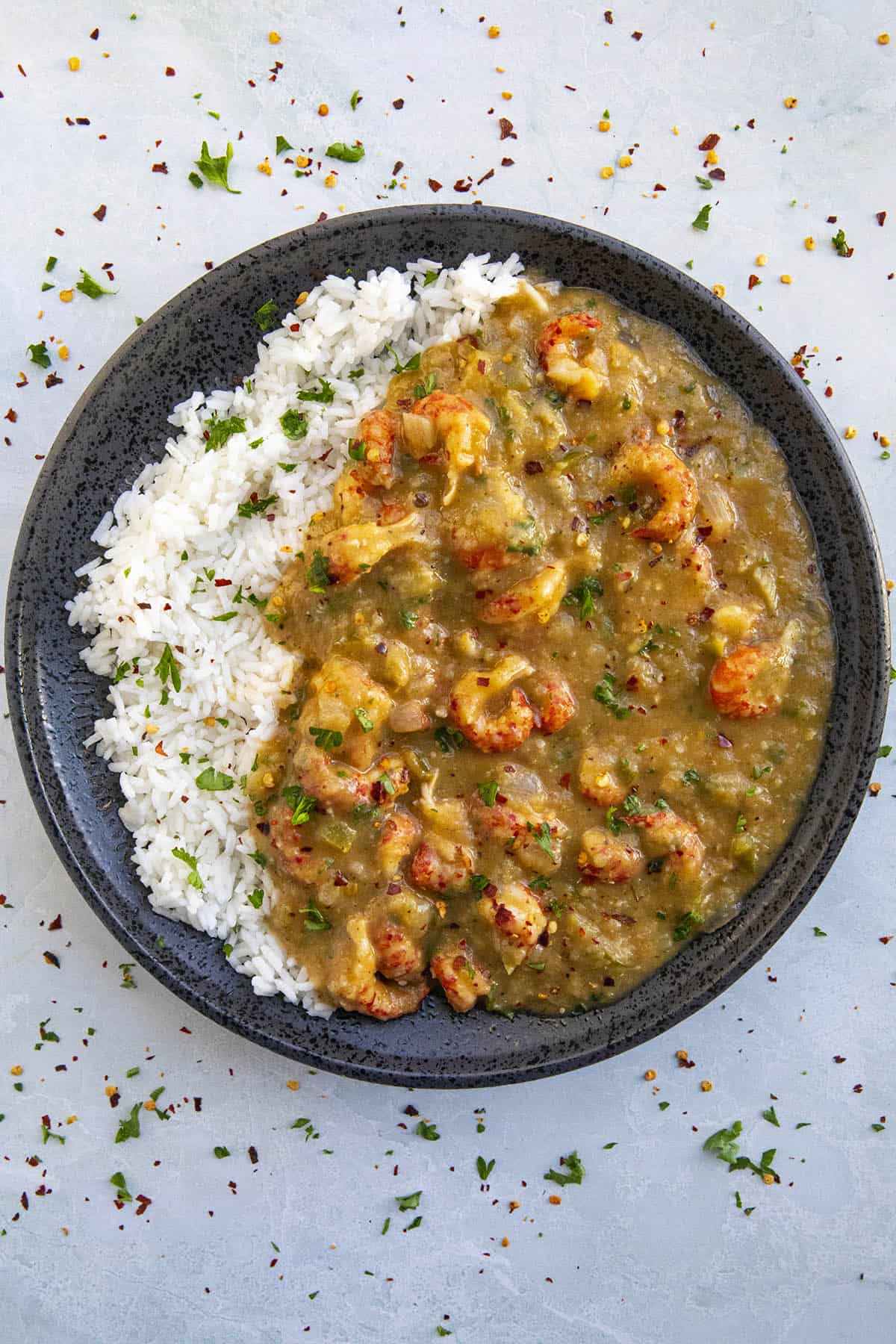 Crawfish Etouffee over white rice with lots of chunky crawfish tails