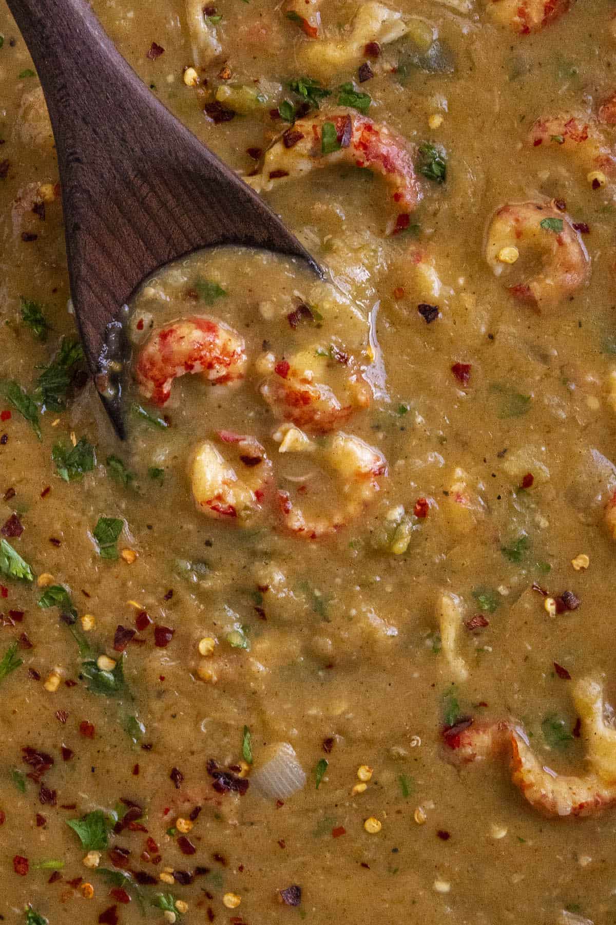 Scooping Crawfish Etouffee from the pan