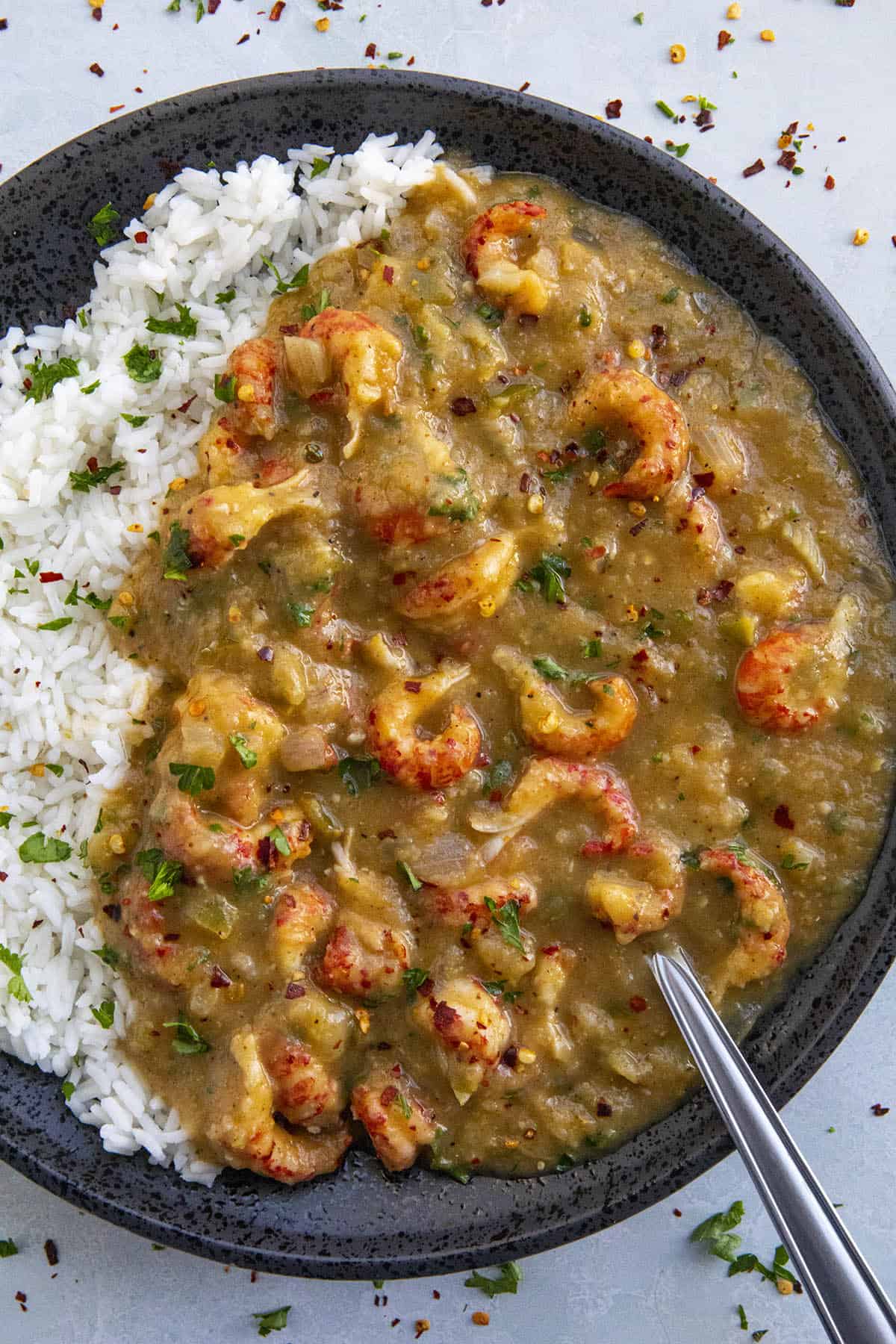 Crawfish Etouffee on a plate over white rice