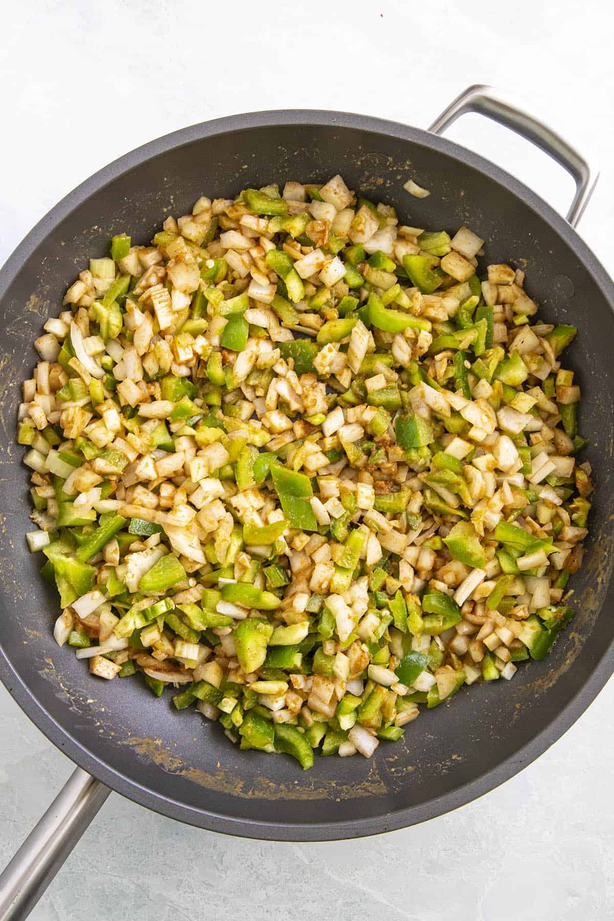 Cooking the vegetables in the roux to make Crawfish Etouffee