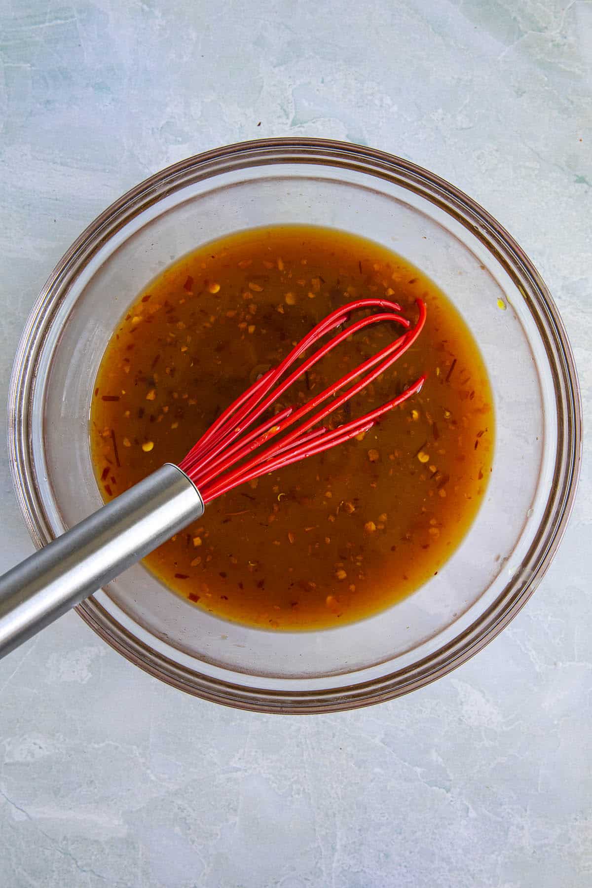 Whisking General Tso Sauce ingredients together in a bowl