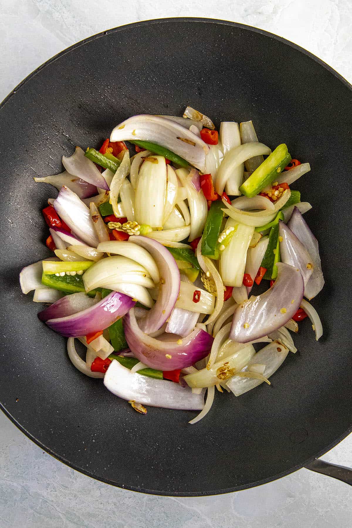 Stir frying the vegetables in a hot pan